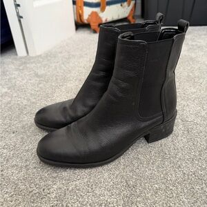 Black leather boots with a chunky heel. Reaction by Kenneth Cole